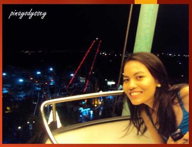 My sister on the wheel.. with the Space Shuttle in the background.