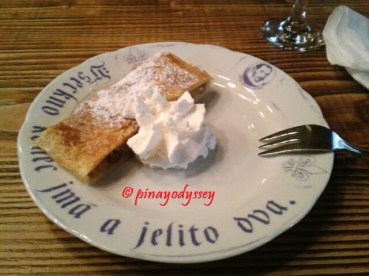 Apple strudel with sour cream for dessert