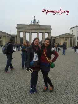My sister and I in front of the gate