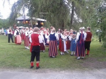 Latvians in their colorful national costumes