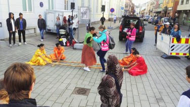 Visitors trying the tinikling, a Filipino folk dance
