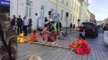 Visitors trying the tinikling, a Filipino folk dance